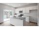 Modern kitchen features granite countertops, a center island, and stainless steel appliances at 132 Fideaux Blvd # 254, Raleigh, NC 27603