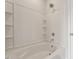 Shower featuring white subway tile and built-in shelving for added convenience and storage at 132 Fideaux Blvd # 254, Raleigh, NC 27603