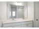 Bathroom with double sinks, white cabinetry, a large mirror and a tile shower in background at 136 Fideaux Blvd # 253, Raleigh, NC 27603