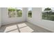 Bright bedroom with multiple windows overlooking greenery and trees outside at 136 Fideaux Blvd # 253, Raleigh, NC 27603