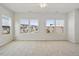 Bright bedroom with multiple windows offering neighborhood views and a ceiling fan at 136 Fideaux Blvd # 253, Raleigh, NC 27603