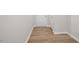 Entry hallway featuring wood floors, a white door, and neutral paint at 136 Fideaux Blvd # 253, Raleigh, NC 27603