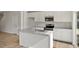 Kitchen featuring a center island with a sink, white cabinets, and stainless steel appliances at 136 Fideaux Blvd # 253, Raleigh, NC 27603