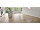 Open concept living area features wood floors, recessed lighting, sliding glass doors, and a kitchen island at 136 Fideaux Blvd # 253, Raleigh, NC 27603