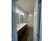 A well-lit bathroom featuring double sinks, dark cabinets, and a shower/tub combo at 142 Vega Loop, Sanford, NC 27330