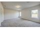 Spacious bedroom with neutral carpeting and large windows at 142 Vega Loop, Sanford, NC 27330