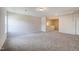 Spacious bonus room with neutral carpet and natural light at 142 Vega Loop, Sanford, NC 27330