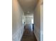 Entryway featuring hardwood flooring and white trim throughout the house at 142 Vega Loop, Sanford, NC 27330