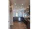 Modern kitchen boasts stainless steel appliances, granite countertops, and ample cabinetry at 142 Vega Loop, Sanford, NC 27330