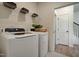 Laundry room with washer, dryer, and shelving at 142 Vega Loop, Sanford, NC 27330