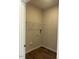 A well-lit laundry room features a wire shelf, and hookups for a washer and dryer at 142 Vega Loop, Sanford, NC 27330