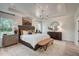 Bright main bedroom featuring a king-size bed and stylish decor at 142 Vega Loop, Sanford, NC 27330