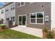 Backyard patio area with sliding glass door, siding and HVAC at 144 Fideaux Blvd # 251, Raleigh, NC 27603