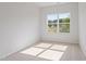 Bright bedroom with a window offering natural light and neutral carpeting at 144 Fideaux Blvd # 251, Raleigh, NC 27603