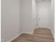 A well-lit entryway displays a white door, hardwood floors, and neutral wall paint at 144 Fideaux Blvd # 251, Raleigh, NC 27603