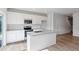 A modern kitchen featuring white cabinets, stainless steel appliances, and granite countertops at 144 Fideaux Blvd # 251, Raleigh, NC 27603