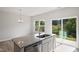 Kitchen island with stainless steel dishwasher, granite countertops and an exterior door at 144 Fideaux Blvd # 251, Raleigh, NC 27603