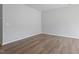 Spacious living room featuring wood-look flooring and neutral paint, creating a bright and welcoming atmosphere at 144 Fideaux Blvd # 251, Raleigh, NC 27603