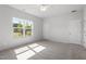Bedroom with a ceiling fan and a bright window that brings in natural light at 148 Fideaux Blvd # 250, Raleigh, NC 27603
