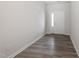 Inviting foyer with wood-look floors and a white front door with glass sidelight at 148 Fideaux Blvd # 250, Raleigh, NC 27603