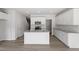 Spacious kitchen featuring a center island, granite countertops, and modern stainless steel appliances at 148 Fideaux Blvd # 250, Raleigh, NC 27603