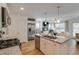 Open-concept kitchen with granite countertops, island, and stainless-steel appliances at 148 Fideaux Blvd # 250, Raleigh, NC 27603