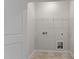 Laundry room features tile flooring, storage, and utility connections at 148 Fideaux Blvd # 250, Raleigh, NC 27603