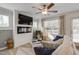 Cozy living room with a modern fireplace, ceiling fan, and plenty of natural light at 148 Fideaux Blvd # 250, Raleigh, NC 27603