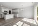 Open-concept living space with a kitchen island and sliding glass doors leading to the backyard at 148 Fideaux Blvd # 250, Raleigh, NC 27603