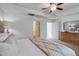 Spacious main bedroom with tray ceiling, ensuite bathroom, and dresser at 148 Fideaux Blvd # 250, Raleigh, NC 27603