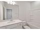 A bathroom featuring white cabinets, a cultured marble countertop, and shower and tub combination at 152 Fideaux Blvd # 249, Raleigh, NC 27603