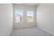 This bedroom has neutral carpeting and two windows for ample natural light at 152 Fideaux Blvd # 249, Raleigh, NC 27603