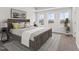 A spacious bedroom boasts natural light, neutral walls, and a trey ceiling at 152 Fideaux Blvd # 249, Raleigh, NC 27603