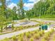 Community fitness area with state-of-the-art equipment, surrounded by lush greenery and a walking path at 152 Fideaux Blvd # 249, Raleigh, NC 27603