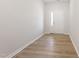 Entry foyer with wood flooring and white door featuring sidelight at 152 Fideaux Blvd # 249, Raleigh, NC 27603