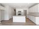 Bright kitchen with granite counters, stainless appliances, and a large center island with sink at 152 Fideaux Blvd # 249, Raleigh, NC 27603