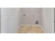 This is a laundry room with tile floors and includes a wire shelf at 152 Fideaux Blvd # 249, Raleigh, NC 27603