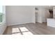 Open-concept room featuring wood floors, recessed lighting, and a large window at 152 Fideaux Blvd # 249, Raleigh, NC 27603