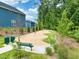 Play area adjacent to blue vinyl sided homes with pea gravel and various fun fixtures to play on for  at 152 Fideaux Blvd # 249, Raleigh, NC 27603