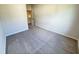 Bedroom with neutral walls and carpeting showing doorway to walk-in closet at 154 Vega Loop, Sanford, NC 27330