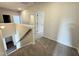 Second floor hallway shows carpeted floor, stairway and doorways to bedrooms at 154 Vega Loop, Sanford, NC 27330