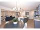 Stylish eat-in kitchen features an island, modern lighting, and an open design at 154 Vega Loop, Sanford, NC 27330
