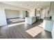 Open floor plan with island, modern lighting, and stainless steel appliances at 154 Vega Loop, Sanford, NC 27330
