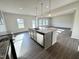 Bright kitchen with island, modern fixtures, and plenty of space for cooking at 154 Vega Loop, Sanford, NC 27330
