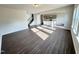 Bright open floor plan with wood floors leading to kitchen and staircase at 154 Vega Loop, Sanford, NC 27330