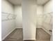 Large walk-in closet with neutral carpeting and white wire shelving at 154 Vega Loop, Sanford, NC 27330