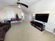 Bonus room with large TV, air hockey table, and ceiling fan at 1936 Sinclair Trce, Burlington, NC 27215