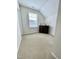 Spacious bonus room with window, carpet, and built-in bar area at 1936 Sinclair Trce, Burlington, NC 27215