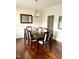 Formal dining room with dark wood table and chairs, hardwood floors and chandelier at 1936 Sinclair Trce, Burlington, NC 27215
