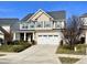 Two-story house with a neutral color scheme and a landscaped front yard at 1936 Sinclair Trce, Burlington, NC 27215